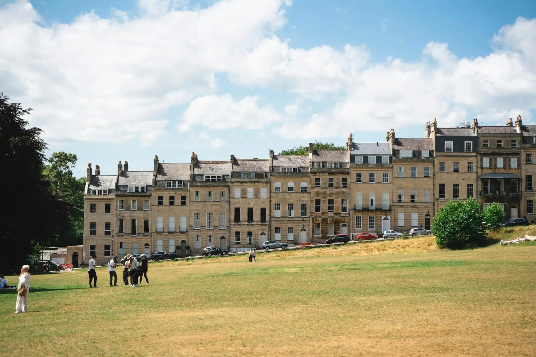 A row of Georgian townhouses in Bath on a sunny day