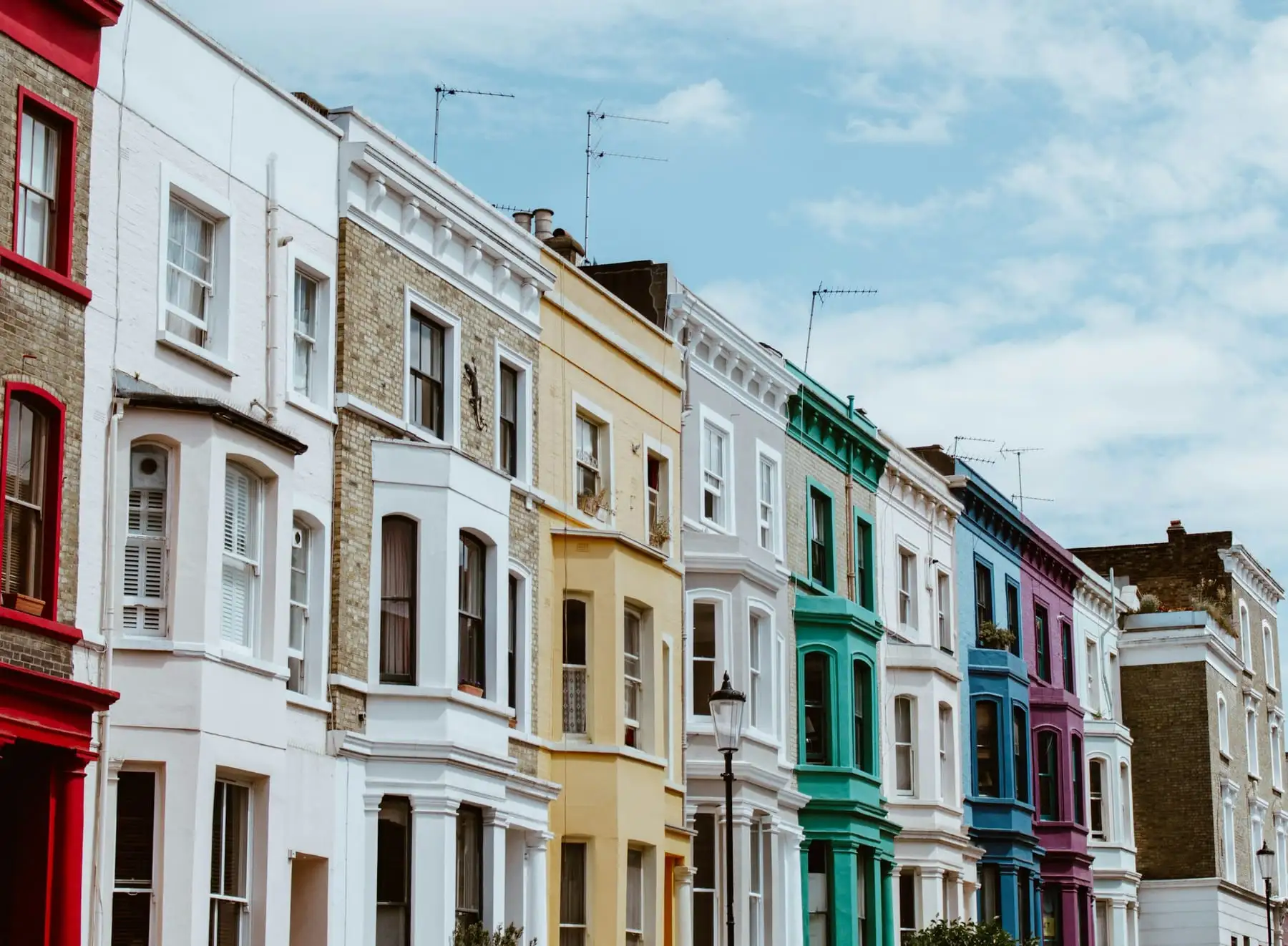 A London terrace of pastel-coloured houses