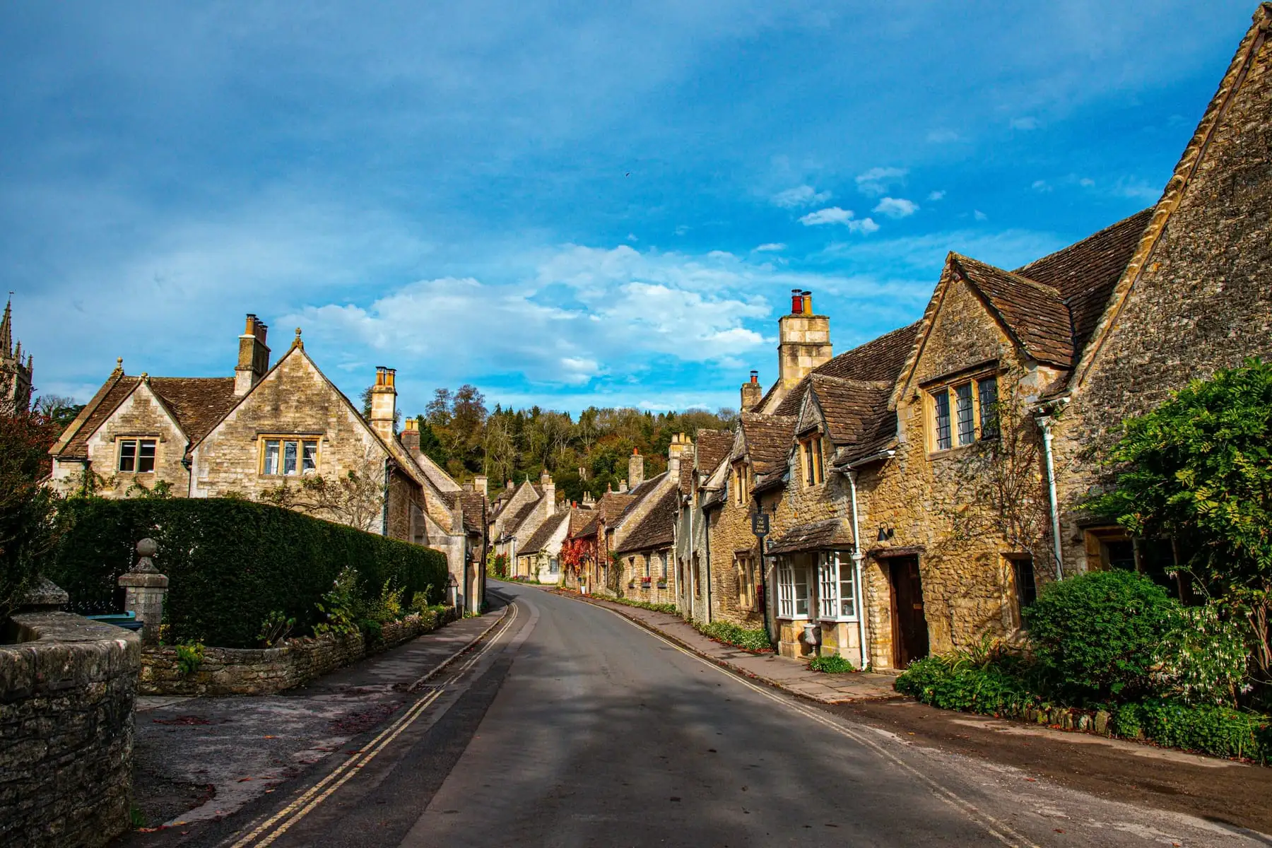 A street of old stone houses in Castle Combe, Wiltshire